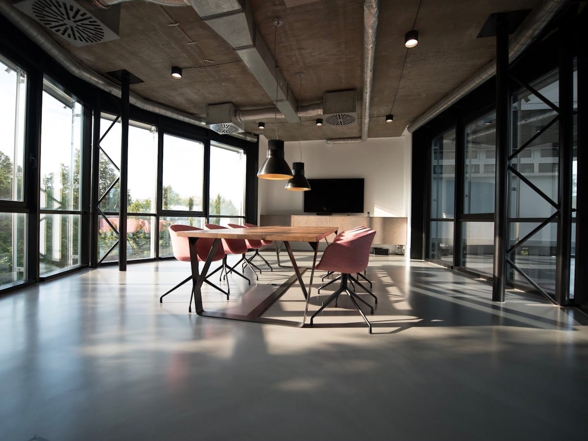 Quiet open-plan office with desks and plants