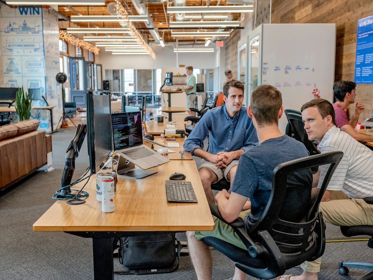Small team meeting at a whiteboard
