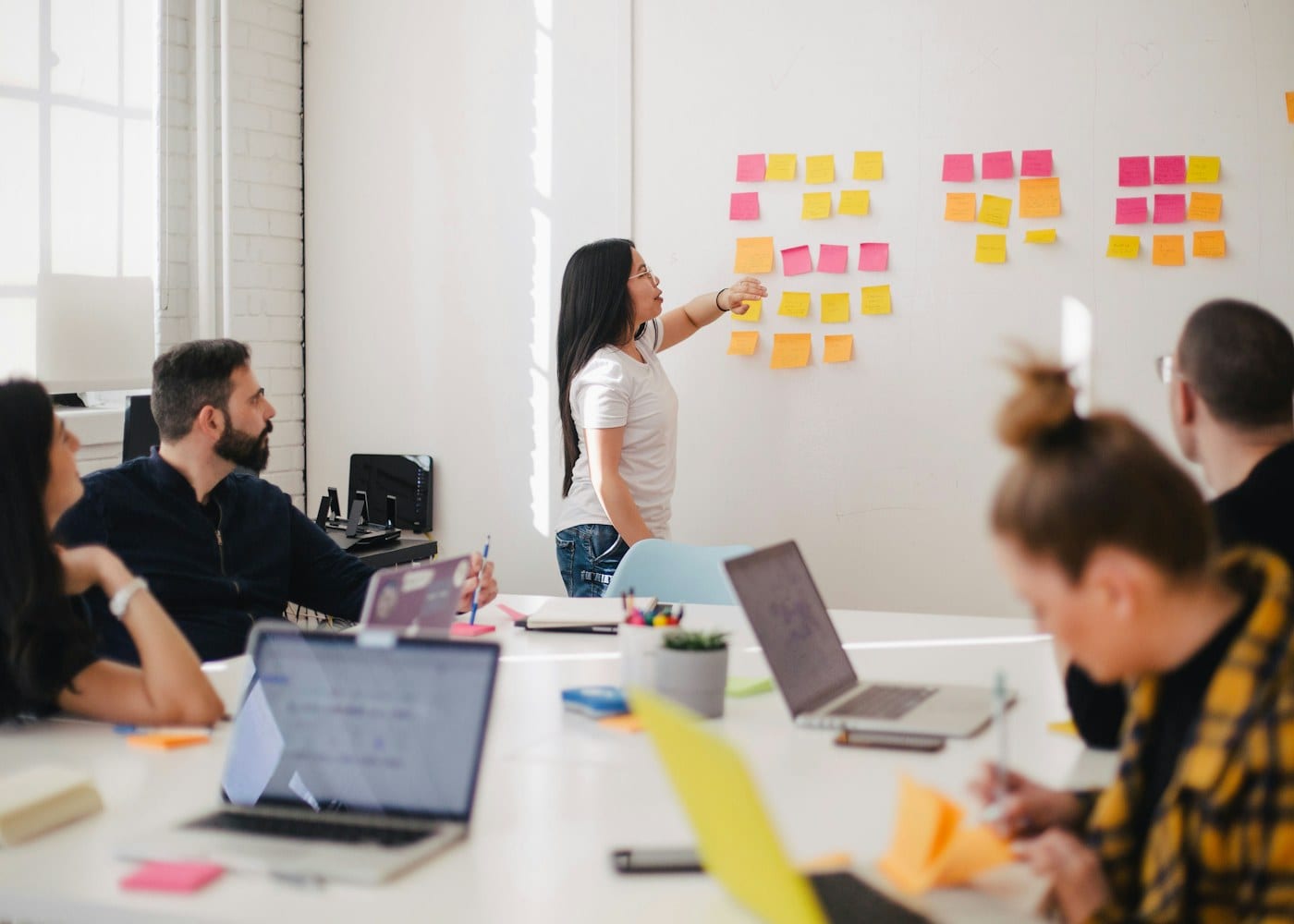 Product team discussing a roadmap around a table
