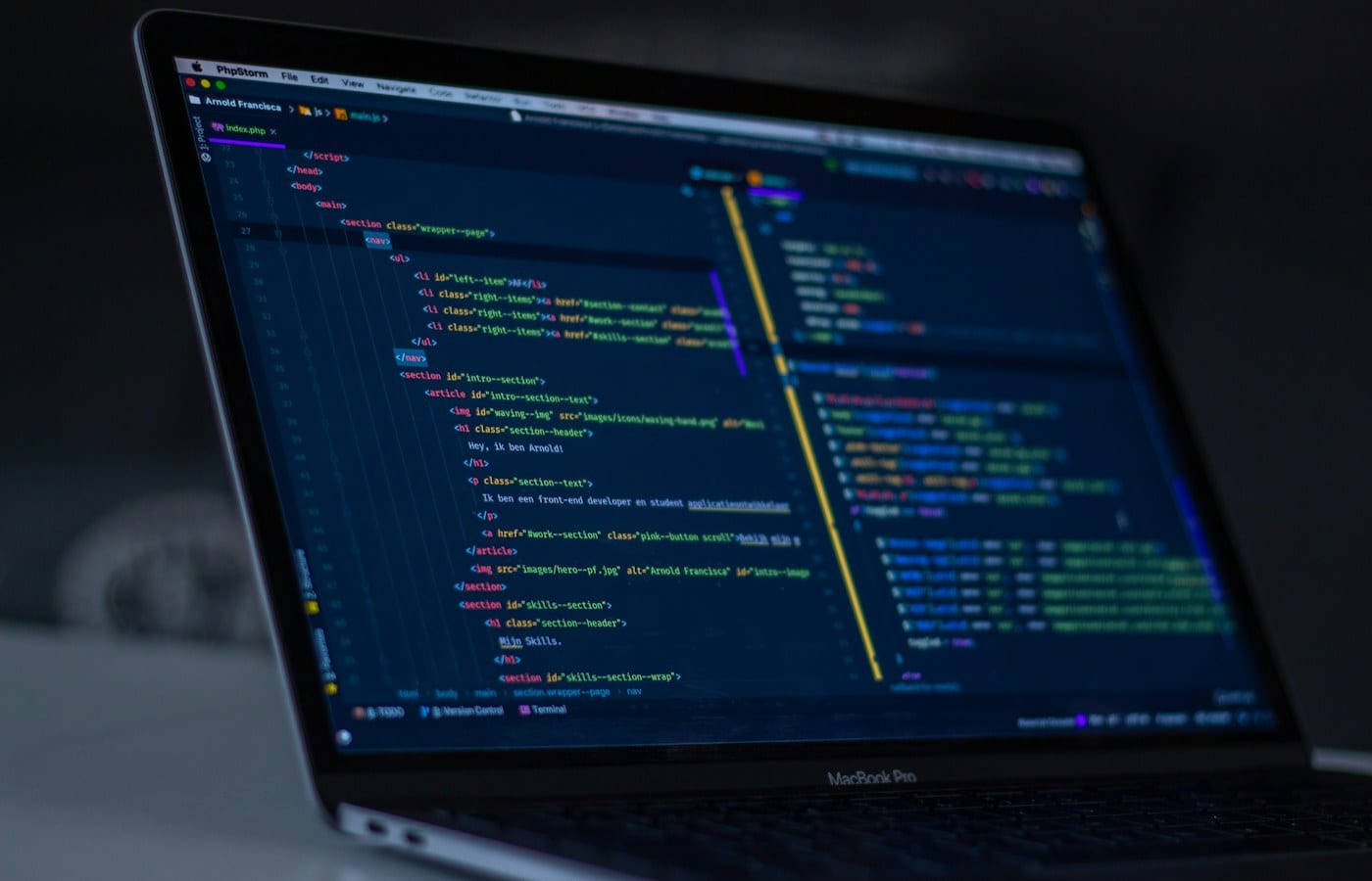 Code editor open on a widescreen monitor