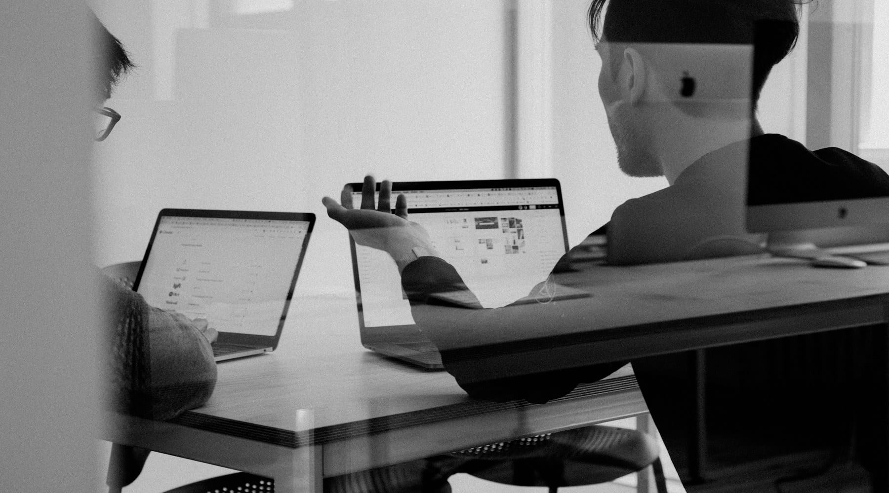 Team reviewing a software product on a large screen