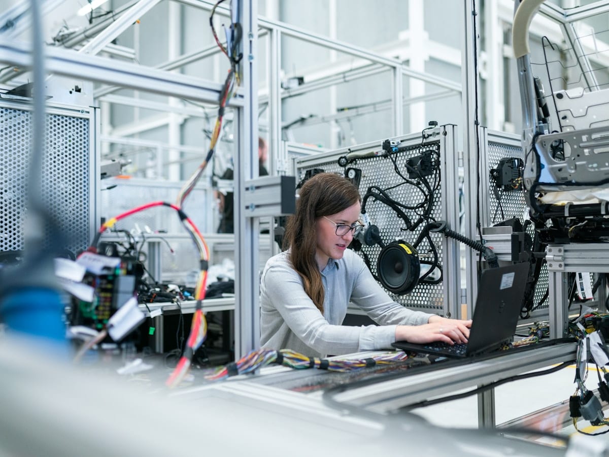 QA engineer working through test cases on a laptop