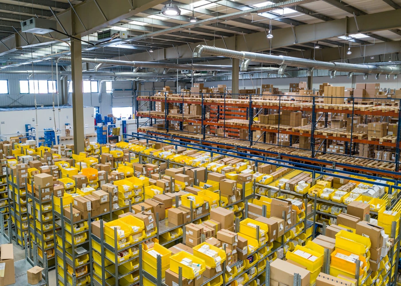 Warehouse operations with a worker scanning a shipment